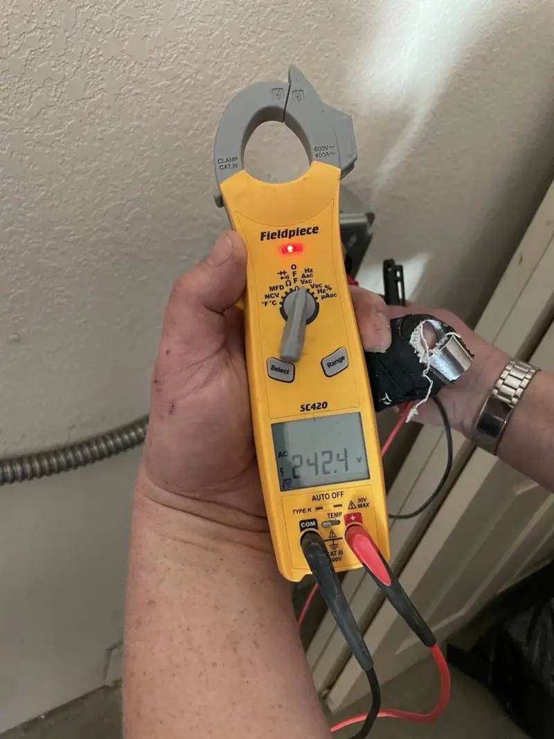Voltage testing with clamp meter during Generator Installation in Reminderville